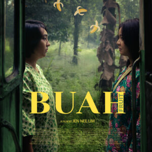 Poster for the short film Buah (Fruit) by Jen Nee Lim. Two women stand facing each other in the doorway of a green bus, surrounded by lush tropical vegetation and banana trees. Small illustrated banana peels float between them. The film title "BUAH" in large yellow text is at the bottom, with the English translation "FRUIT" vertically beside it. Credits and crew information appear below the title.